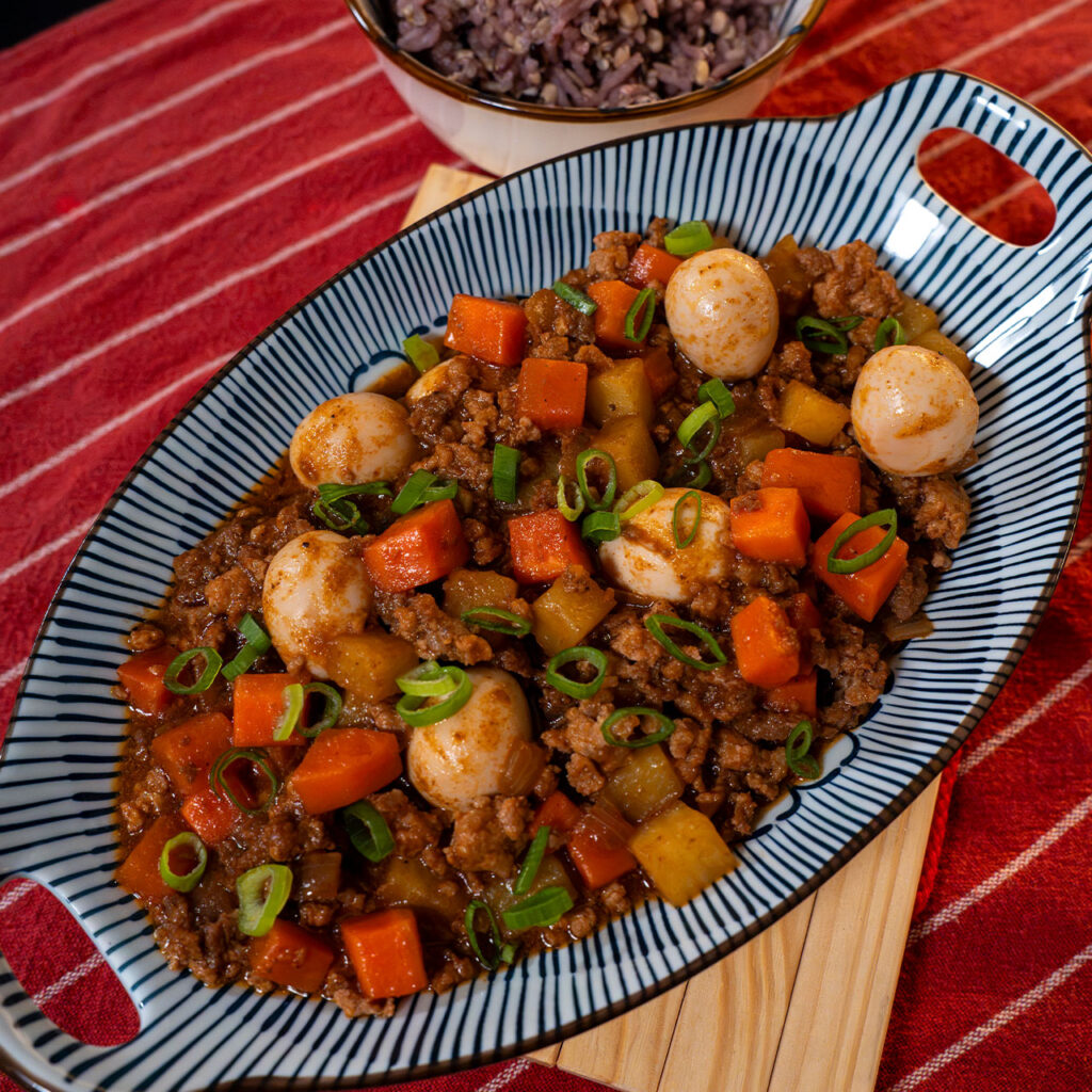 Giniling with ground pork, potatoes, carrots, and quail eggs served with rice