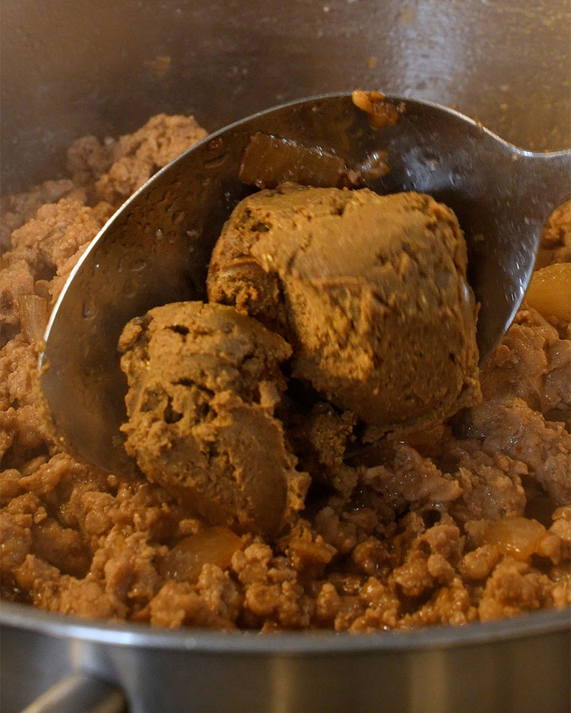Liver spread being mixed into Giniling sauce